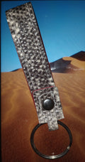 Snake print leather keychain with red suede inside
